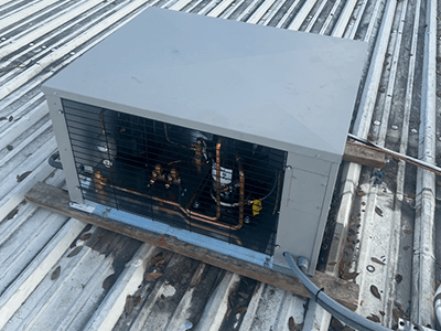 Located condenser to roof